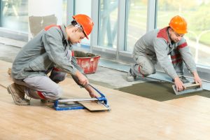 men installing tiles for home renovation